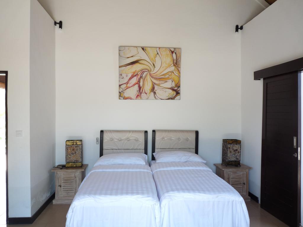 Taman Dewi Sri Villa et Bungalow Pemuteran Rum bild